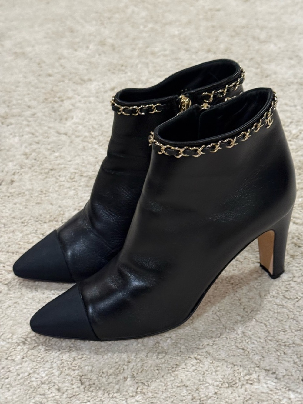 CHANEL Black Leather Ankle Booties with Chain Accent